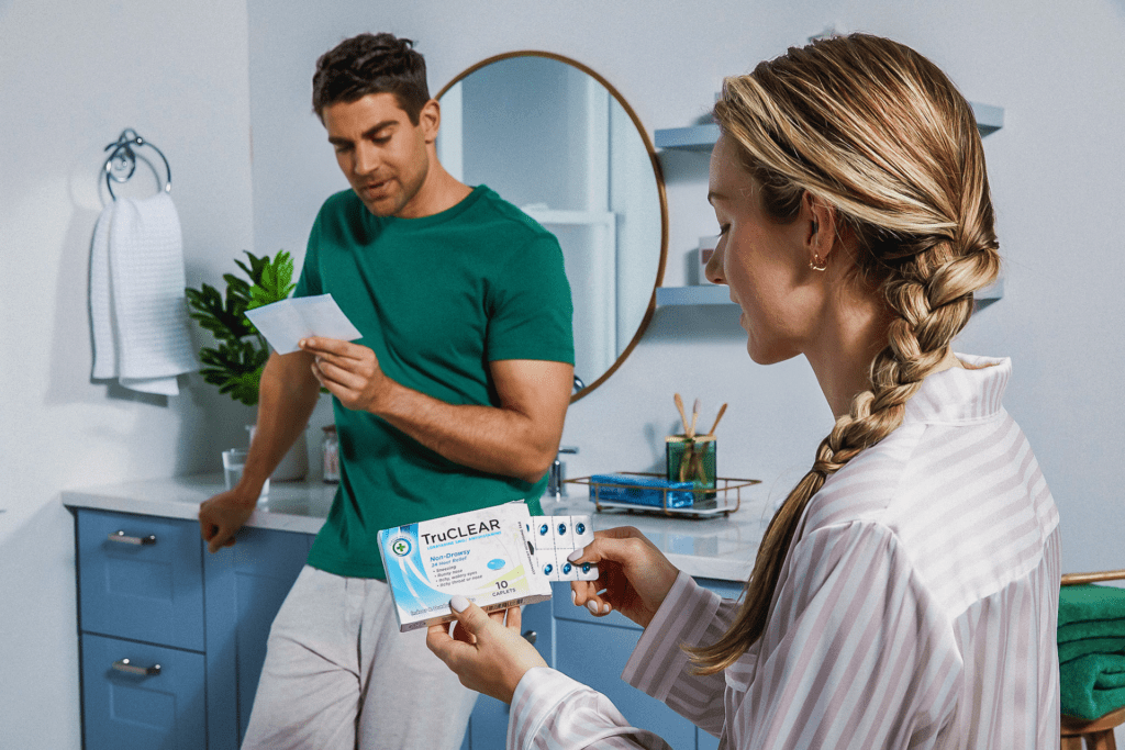 Woman opening medication in a blister pack