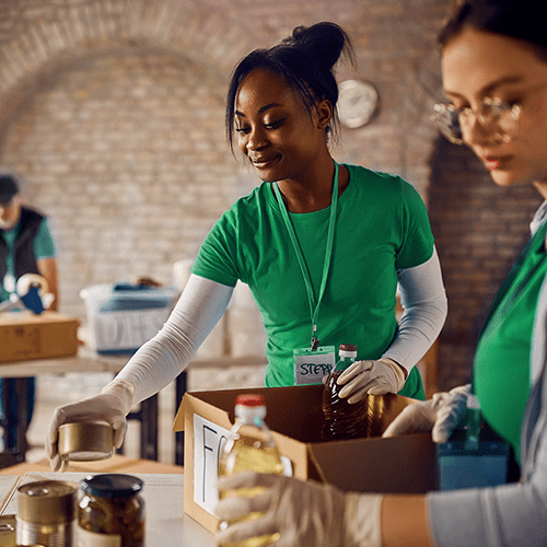 Volunteers placing food on table