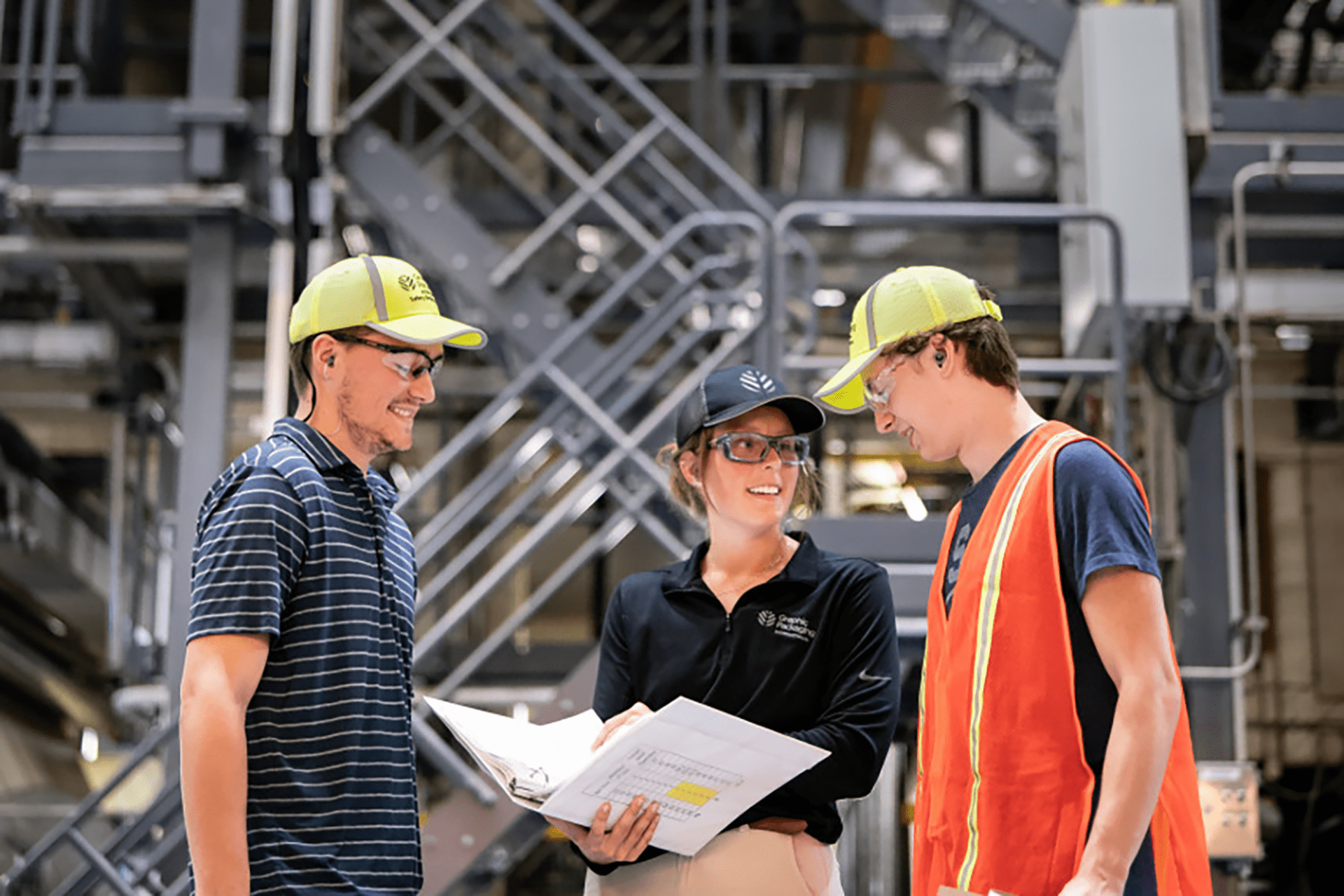 A group of Graphic Packaging International employees talking