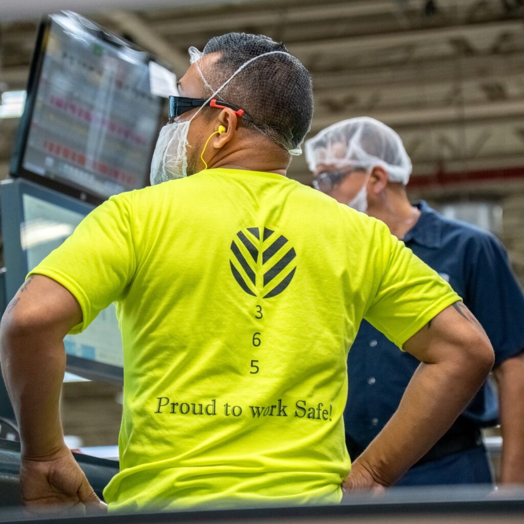 Two employees working inside the Graphic Packaging facility
