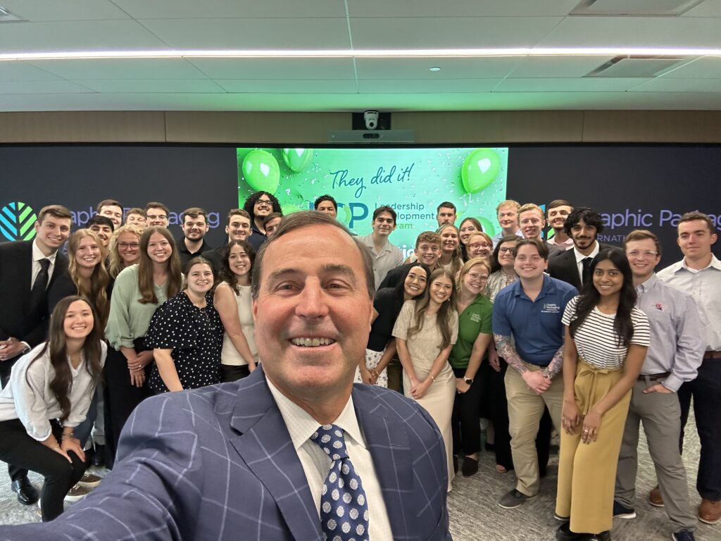 CEO Mike Doss taking a selfie with the Leadership Development Program (LDP) employees