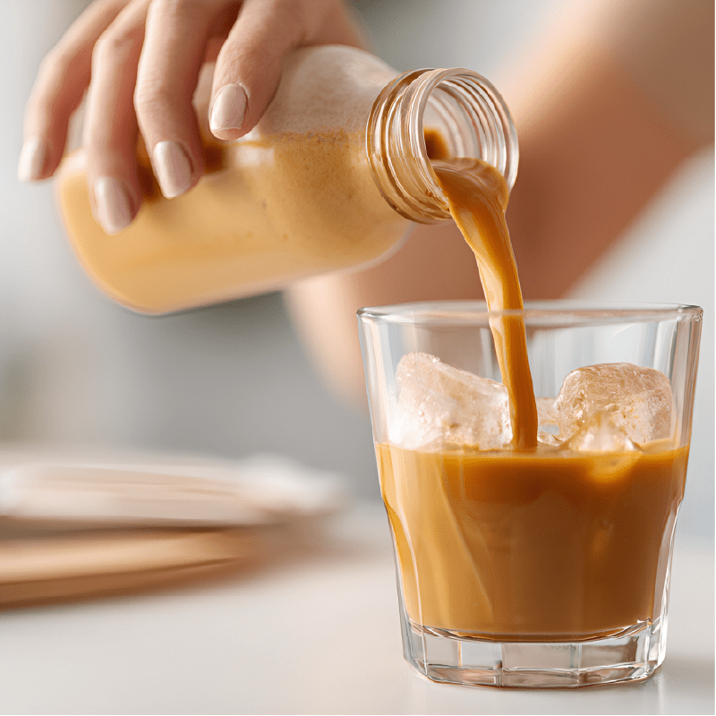 Woman pouring a ready-to-drink coffee