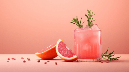 Beige background mocktail Paloma with grapefruit soda lime garnish and rosemary sprig