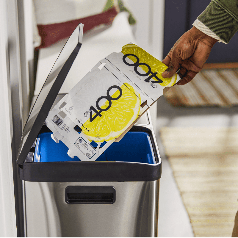Multipack being placed into recycling bin