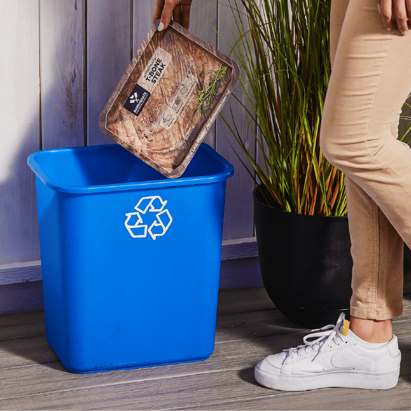 PaperSeal tray being placed into recycling bin
