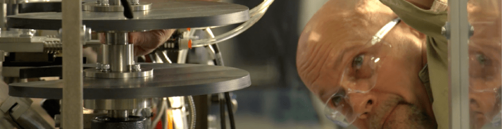 Man adjusting a machine