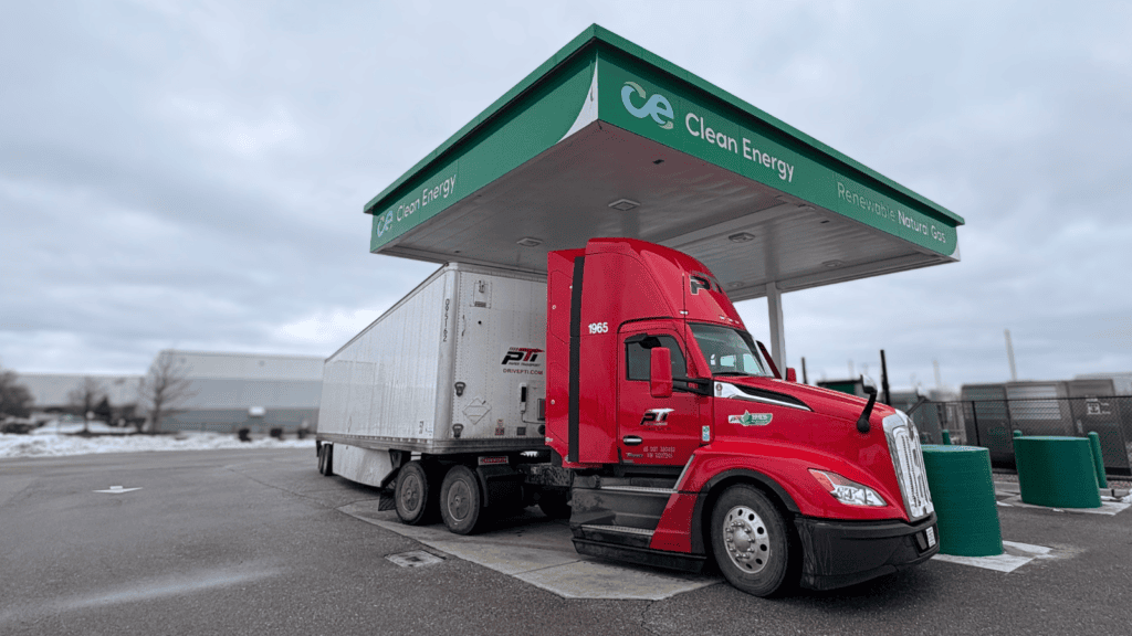 Red renewable natural gas truck at a Clean Energy fueling station in the Midwest.
